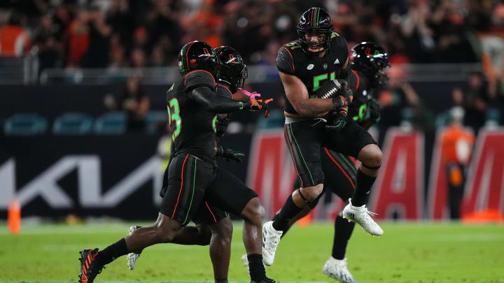 Oct 7, 2023; Miami Gardens, Florida, USA; Miami Hurricanes linebacker Francisco Mauigoa (51) celebrates after intercepting a pass form Georgia Tech Yellow Jackets quarterback Haynes King (not pictured) in the first half at Hard Rock Stadium. Mandatory Credit: Jasen Vinlove-USA TODAY Sports