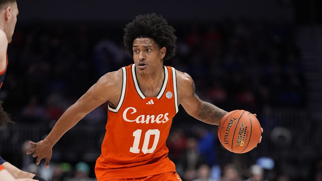 Mar 13, 2026; Charlotte, NC, USA; Miami Hurricanes guard Tru Washington (10) dribbles the ball during the second half against the Virginia Cavaliers at Spectrum Center. Mandatory Credit: Jim Dedmon-Imagn Images