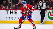 Montreal Canadiens center Nick Suzuki (14) plays the puck against the Colorado Avalanche in shootout at Bell Centre.