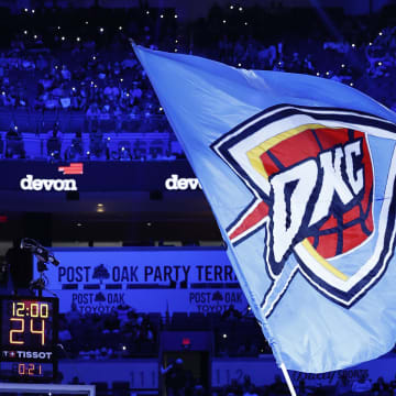 Apr 10, 2024; Oklahoma City, Oklahoma, USA; Oklahoma City Thunder mascot, Rumble the Bison, waves a giant flag during a time out against the San Antonio Spurs during the second half at Paycom Center. Mandatory Credit: Alonzo Adams-USA TODAY Sports