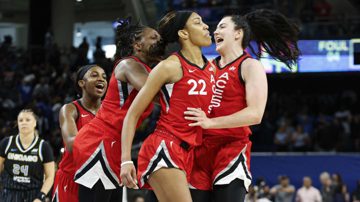 Aug 25, 2024; Chicago, Illinois, USA; Las Vegas Aces center A'ja Wilson (22) celebrates with teammates after scoring game winning basket against the Chicago Sky during the second half at Wintrust Arena. Mandatory Credit: Kamil Krzaczynski-USA TODAY Sports