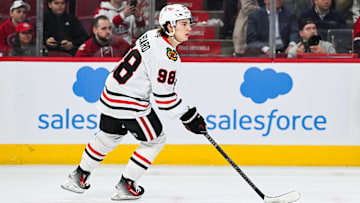 Apr 14, 2025; Montreal, Quebec, CAN; Chicago Blackhawks center Connor Bedard (98) plays the puck against the Montreal Canadiens in overtime at Bell Centre. Mandatory Credit: David Kirouac-Imagn Images