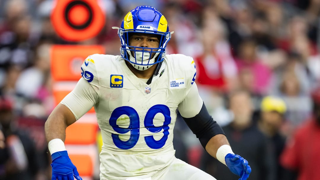 Nov 26, 2023; Glendale, Arizona, USA; Los Angeles Rams defensive tackle Aaron Donald (99) against the Arizona Cardinals at State Farm Stadium. Mandatory Credit: Mark J. Rebilas-Imagn Images