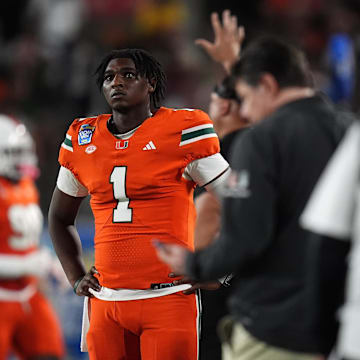 Miami Hurricanes quarterback Cam Ward looks up at the scoreboard during the second half against the Iowa State Cyclones during the Pop-Tarts Bowl.