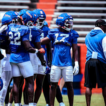 The Florida Gators edge rushers group together during the team's position drills period on Saturday.