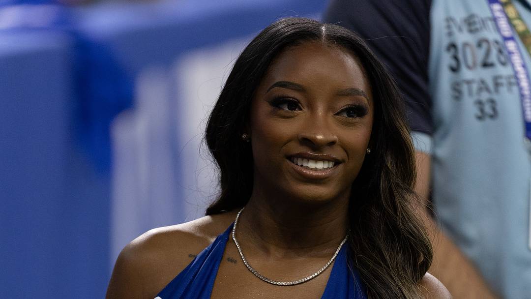 Sep 13, 2026; Indianapolis, Indiana, USA;  USA gymnast Simone Biles looks on before the game between Ravens and Colts at Lucas Oil Stadium.  Mandatory Credit: Trevor Ruszkowski-Imagn Images