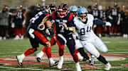 Nov 9, 2024; Montreal, Quebec, CAN; Montreal Alouettes quarterback Cody Fajardo (7) runs the ball against Toronto Argonauts defensive linesman Jake Ceresna (94) during the third quarter at Percival-Molson Memorial Stadium. Mandatory Credit: David Kirouac-Imagn Images