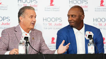 Arkansas men’s basketball head coach John Calipari answers a question as Memphis men’s basketball coach Penny Hardaway looks on during a press conference for the Hoops for St. Jude Tip Off Classic at FedExForum on September 2, 2025.