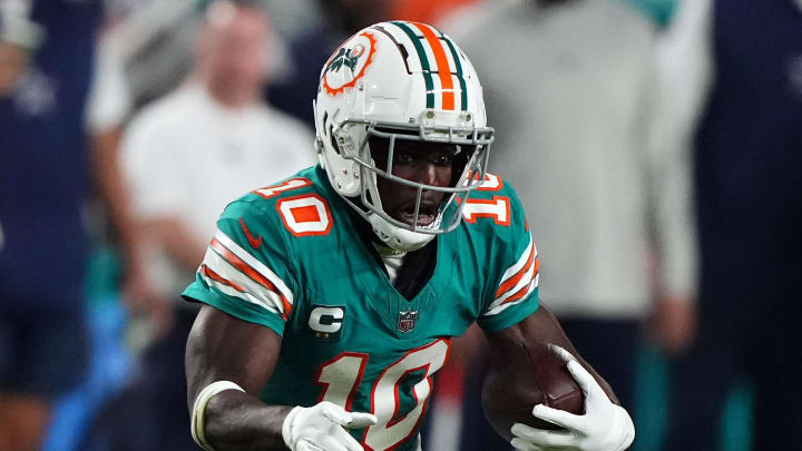 Dec 24, 2023; Miami Gardens, Florida, USA; Miami Dolphins wide receiver Tyreek Hill (10) runs with the ball against the Dallas Cowboys during the second half at Hard Rock Stadium. Mandatory Credit: Jasen Vinlove-USA TODAY Sports