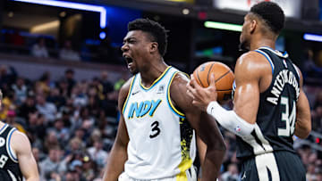Dec 31, 2024; Indianapolis, Indiana, USA; Indiana Pacers center Thomas Bryant (3) reacts to a made basket in the first half against the Milwaukee Bucks at Gainbridge Fieldhouse. Mandatory Credit: Trevor Ruszkowski-Imagn Images