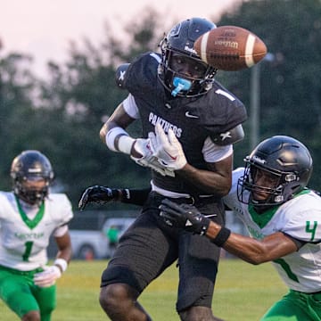 David Aboya (1) can't reel in the pass during the Choctaw vs Milton preseason football game at Milton High School on Thursday, Aug. 15, 2024.