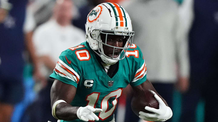 Dec 24, 2023; Miami Gardens, Florida, USA; Miami Dolphins wide receiver Tyreek Hill (10) runs with the ball against the Dallas Cowboys during the second half at Hard Rock Stadium. Mandatory Credit: Jasen Vinlove-USA TODAY Sports