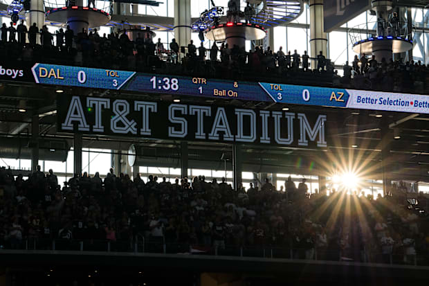 A view of the stadium and the fans and the setting sun during the game between the Dallas Cowboys and the Arizona Cardinals. 