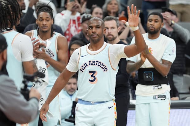 San Antonio Spurs guard Chris Paul (3) is recognized after moving into second place on the all-time assist leaders list in th