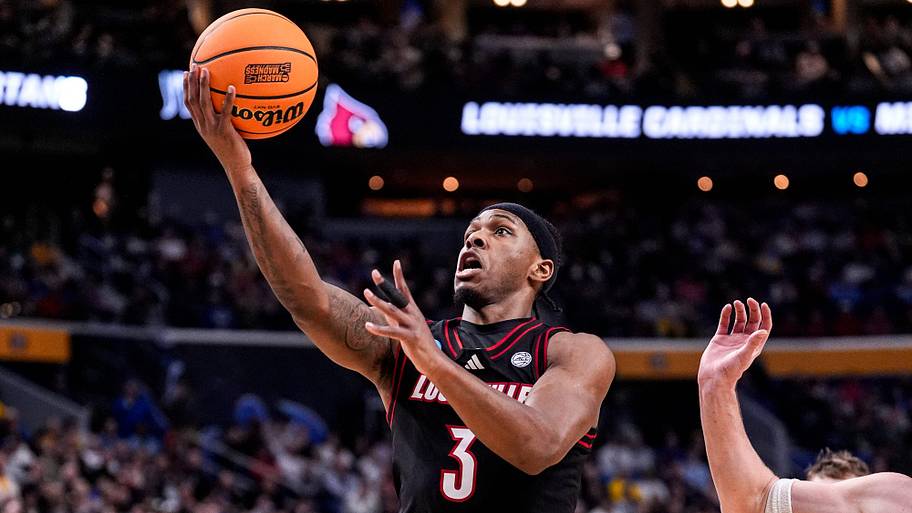 Louisville guard Ryan Conwell goes to the basket against Michigan State.
