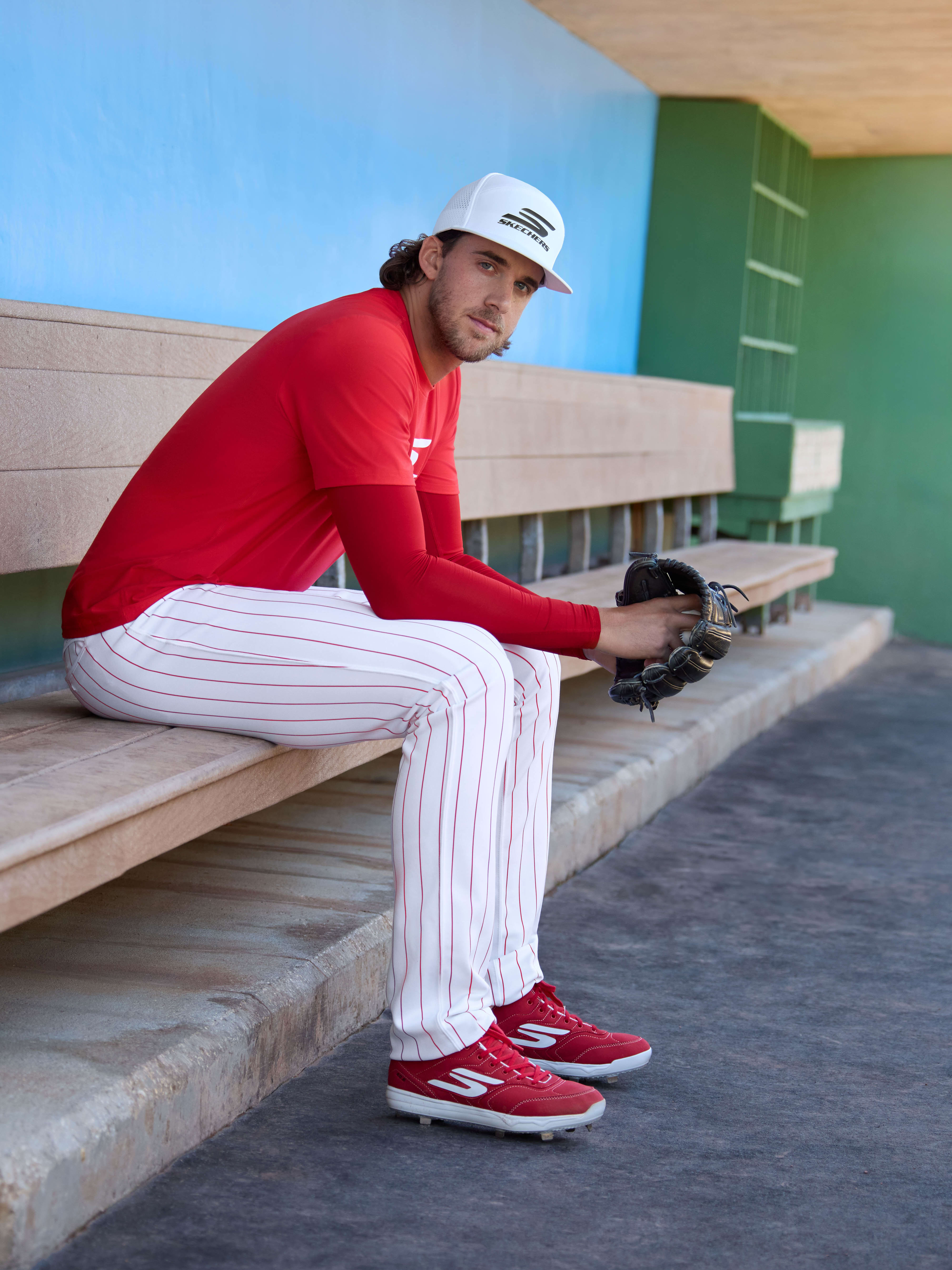 Aaron Nola sits in a dugout for a photo shoot.
