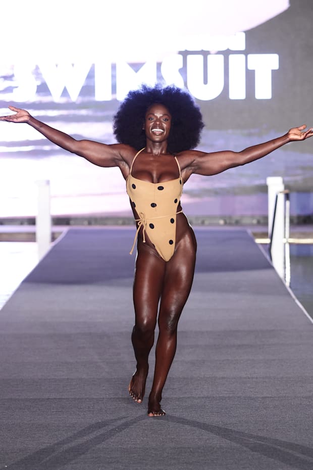 Tunde Oyeneyin walks the runway for the Sports Illustrated Swimsuit Runway Show