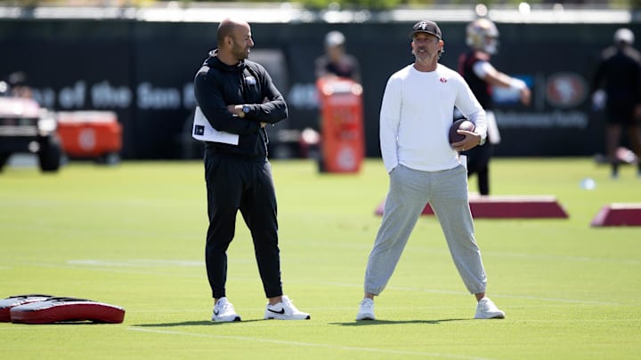 Jun 10, 2025; Santa Clara, CA, USA; San Francisco 49ers head coach Kyle Shanahan (right) and defensive coordinator Robert Saleh confer during an OTA at Levi's Stadium. Mandatory Credit: D. Ross Cameron-Imagn Images