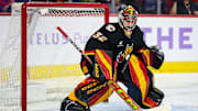 Nov 21, 2024; Calgary, Alberta, CAN; Calgary Flames goaltender Dustin Wolf (32) guards his net against the New York Rangers during the first period at Scotiabank Saddledome. Mandatory Credit: Sergei Belski-Imagn Images
