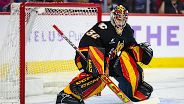 Nov 21, 2024; Calgary, Alberta, CAN; Calgary Flames goaltender Dustin Wolf (32) guards his net against the New York Rangers during the first period at Scotiabank Saddledome. Mandatory Credit: Sergei Belski-Imagn Images