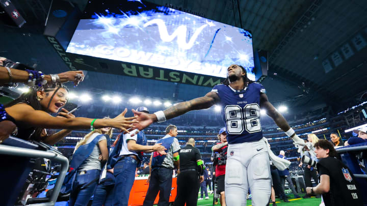 Dec 30, 2023; Arlington, Texas, USA;  Dallas Cowboys wide receiver CeeDee Lamb (88) celebrates with fans after the game against the Detroit Lions at AT&T Stadium. 