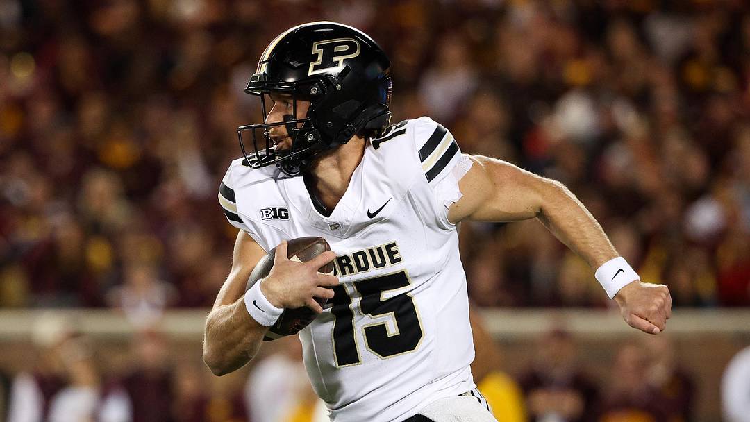 Purdue Boilermakers quarterback Ryan Browne (15) runs the ball.