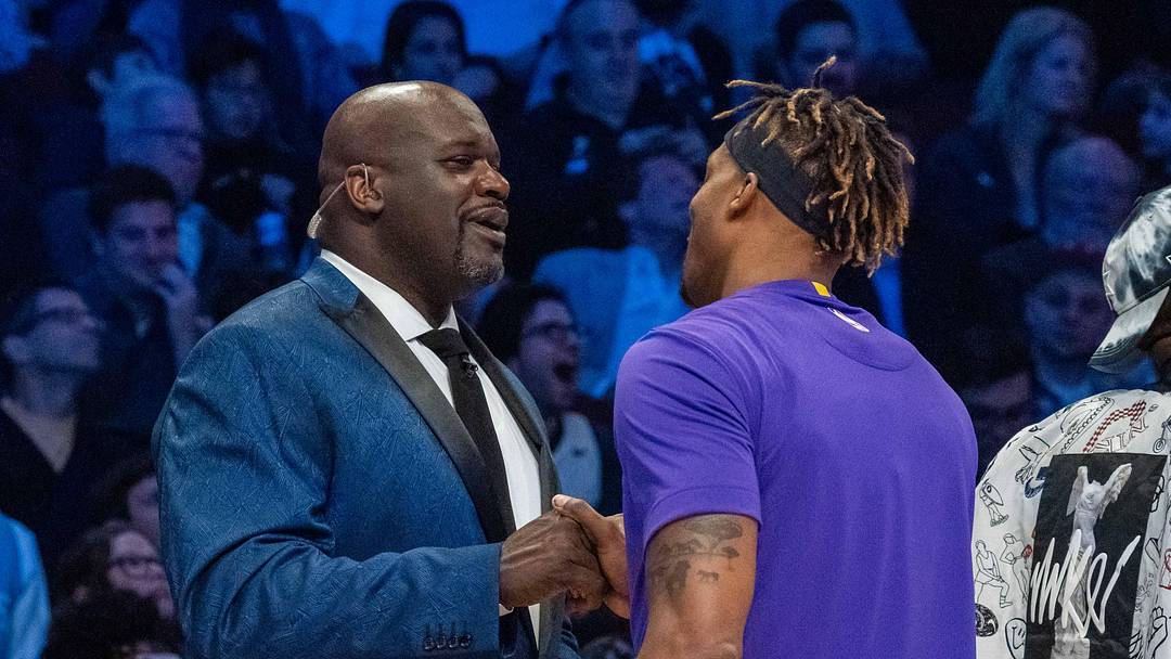 February 15, 2020; Chicago, Illinois, USA; NBA great Shaquille O'Neal (left) shakes hands with Los Angeles Lakers player Dwight Howard (right) during NBA All Star Saturday Night at United Center. Mandatory Credit: Kyle Terada-Imagn Images