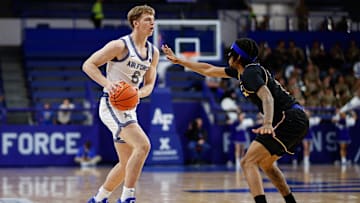 Jan 11, 2025; Colorado Springs, Colorado, USA; Air Force Falcons forward Will Cooper (6) controls the ball as San Jose State Spartans guard Donavan Yap Jr. (0) guards in the second half at Clune Arena.