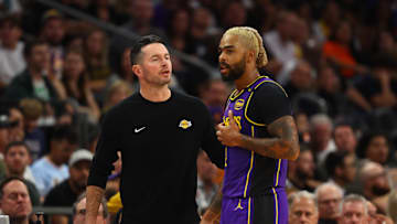 Oct 28, 2024; Phoenix, Arizona, USA; Los Angeles Lakers head coach JJ Redick with guard D'Angelo Russell (1) against the Phoenix Suns at Footprint Center. Mandatory Credit: Mark J. Rebilas-Imagn Images