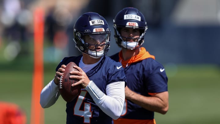 May 23, 2024; Englewood, CO, USA; Denver Broncos quarterback Zach Wilson (4) and quarterback Jarrett Stidham (8) during organized team activities at Centura Health Training Center. Mandatory Credit: Isaiah J. Downing-USA TODAY Sports