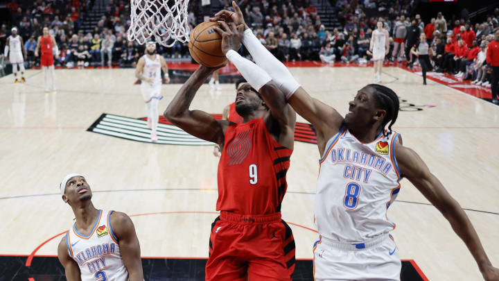 Mar 6, 2024; Portland, Oregon, USA; Portland Trail Blazers small forward Jerami Grant (9) shoots the ball against Oklahoma City Thunder forward Jalen Williams (8) during the second half at Moda Center. Mandatory Credit: Soobum Im-USA TODAY Sports