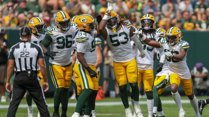 Green Bay Packers DE Arron Mosby (53) celebrates with his teamates after intercepting a pass against the Baltimore Ravens on Saturday.