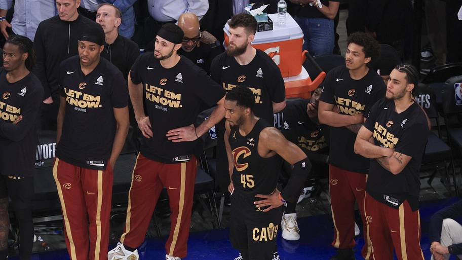 Cleveland Cavaliers guard Donovan Mitchell reacts with teammates after losing to the New York Knicks.