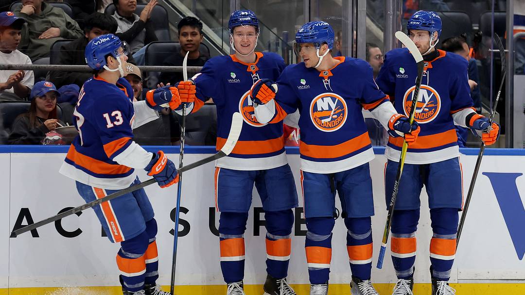 Mar 30, 2026; Elmont, New York, USA; New York Islanders center Brayden Schenn (10) celebrates his goal against the Pittsburgh Penguins with center Mathew Barzal (13) and center Calum Ritchie (64) and defenseman Carson Soucy (4) during the second period at UBS Arena. Mandatory Credit: Brad Penner-Imagn Images
