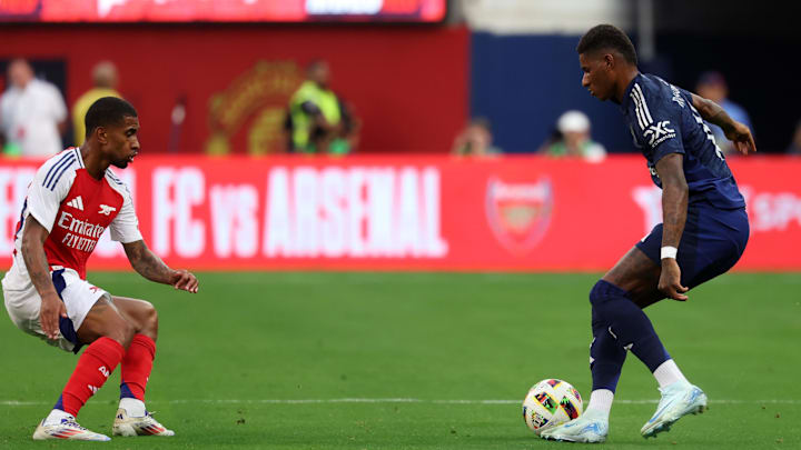 Jul 27, 2024; Inglewood, CA, USA;  Manchester United forward Marcus Rashford (10) controls the ball against Arsenal forward Reiss Nelson (24) during the first half at SoFi stadium. Mandatory Credit: Kiyoshi Mio-Imagn Images