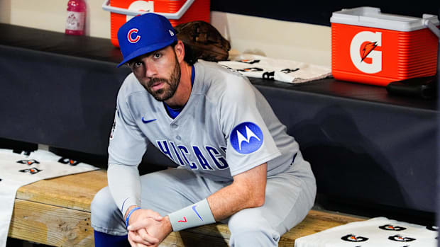 Dansby Swanson of Chicago Cubs sits on bench