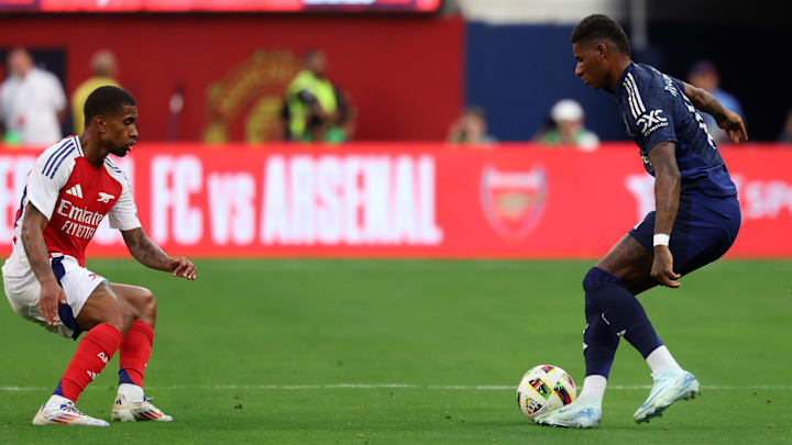 Jul 27, 2024; Inglewood, CA, USA;  Manchester United forward Marcus Rashford (10) controls the ball against Arsenal forward Reiss Nelson (24) during the first half at SoFi stadium. Mandatory Credit: Kiyoshi Mio-Imagn Images