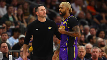 Oct 28, 2024; Phoenix, Arizona, USA; Los Angeles Lakers head coach JJ Redick with guard D'Angelo Russell (1) against the Phoenix Suns at Footprint Center. Mandatory Credit: Mark J. Rebilas-Imagn Images
