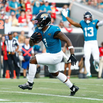 Aug 10, 2024; Jacksonville, Florida, USA; Jacksonville Jaguars running back Travis Etienne Jr. (1) runs the ball in for a touchdown during the first quarter against the Kansas City Chiefs at EverBank Stadium. Mandatory Credit: Douglas DeFelice-USA TODAY Sports