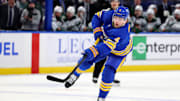 Nov 27, 2024; Buffalo, New York, USA;  Buffalo Sabres defenseman Bowen Byram (4) takes a shot on goal during the second period against the Minnesota Wild at KeyBank Center. Mandatory Credit: Timothy T. Ludwig-Imagn Images