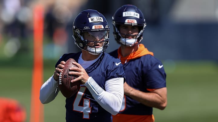 May 23, 2024; Englewood, CO, USA; Denver Broncos quarterback Zach Wilson (4) and quarterback Jarrett Stidham (8) during organized team activities at Centura Health Training Center. Mandatory Credit: Isaiah J. Downing-Imagn Images