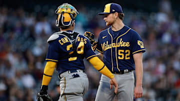 Milwaukee Brewers catcher William Contreras (24) visits starting pitcher Eric Lauer (52)