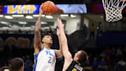 Nov 18, 2024; Pittsburgh, Pennsylvania, USA;  Pittsburgh Panthers forward Cameron Corhen (2) shoots against Virginia Military Keydets forward TJ Johnson (44) during the first half at the Petersen Events Center. Mandatory Credit: Charles LeClaire-Imagn Images