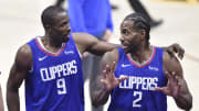 LA Clippers center Serge Ibaka (9) and forward Kawhi Leonard (2) walk to the locker room at halftime against the Cleveland Cavaliers at Rocket Mortgage FieldHouse. Mandatory Credit: 