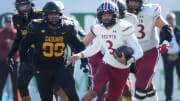 Red Mountain quarterback Simon Lopez (3) scrambles out of the pocket against Saguaro during their 6A State Championship game at Mountain America Stadium in Tempe on Dec. 2, 2023.