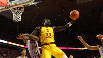 Jan 24, 2024; Ames, Iowa, USA; Iowa State Cyclones forward Omaha Biliew (33) is fouled by Kansas State Wildcats forward David N'Guessan (1) at James H. Hilton Coliseum. Mandatory Credit: Reese Strickland-USA TODAY Sports