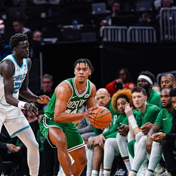 Apr 12, 2024; Boston, Massachusetts, USA; Boston Celtics guard Jaden Springer (44) passes the ball against Charlotte Hornets forward JT Thor (21) in the second half at TD Garden. Mandatory Credit: David Butler II-Imagn Images