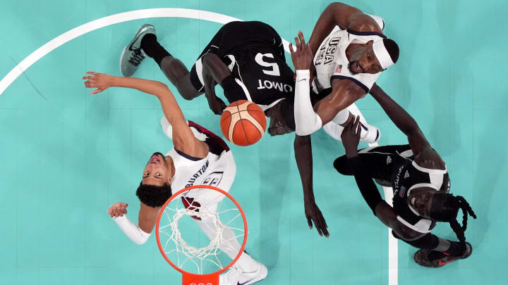 Jul 31, 2024; Villeneuve-d'Ascq, France; United States guard Tyrese Haliburton (9) and center Bam Adebayo (13) fight for position with South Sudan small forward Nuni Omot (5) and power forward Wenyen Gabriel (9) in the second quarter during the Paris 2024 Olympic Summer Games at Stade Pierre-Mauroy. Mandatory Credit: John David Mercer-USA TODAY Sports