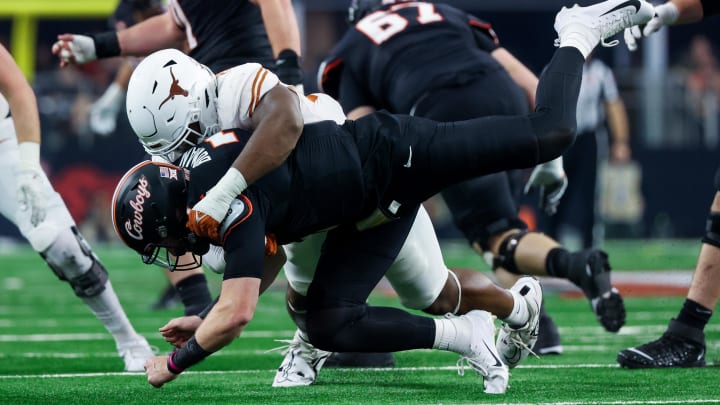 Dec 2, 2023; Arlington, TX, USA;  Texas Longhorns defensive end Barryn Sorrell (88) pressures Oklahoma State Cowboys quarterback Alan Bowman (7) during the first half at AT&T Stadium. Mandatory Credit: Kevin Jairaj-USA TODAY Sports