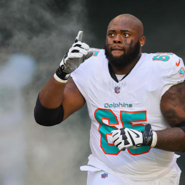 Miami Dolphins guard Robert Jones enters the field before the game against the New York Jets at Hard Rock Stadium last December.